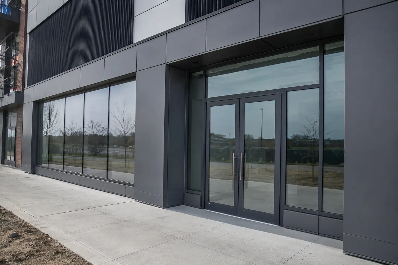 Facade Renovation across Maple property by Ardenvale Construction